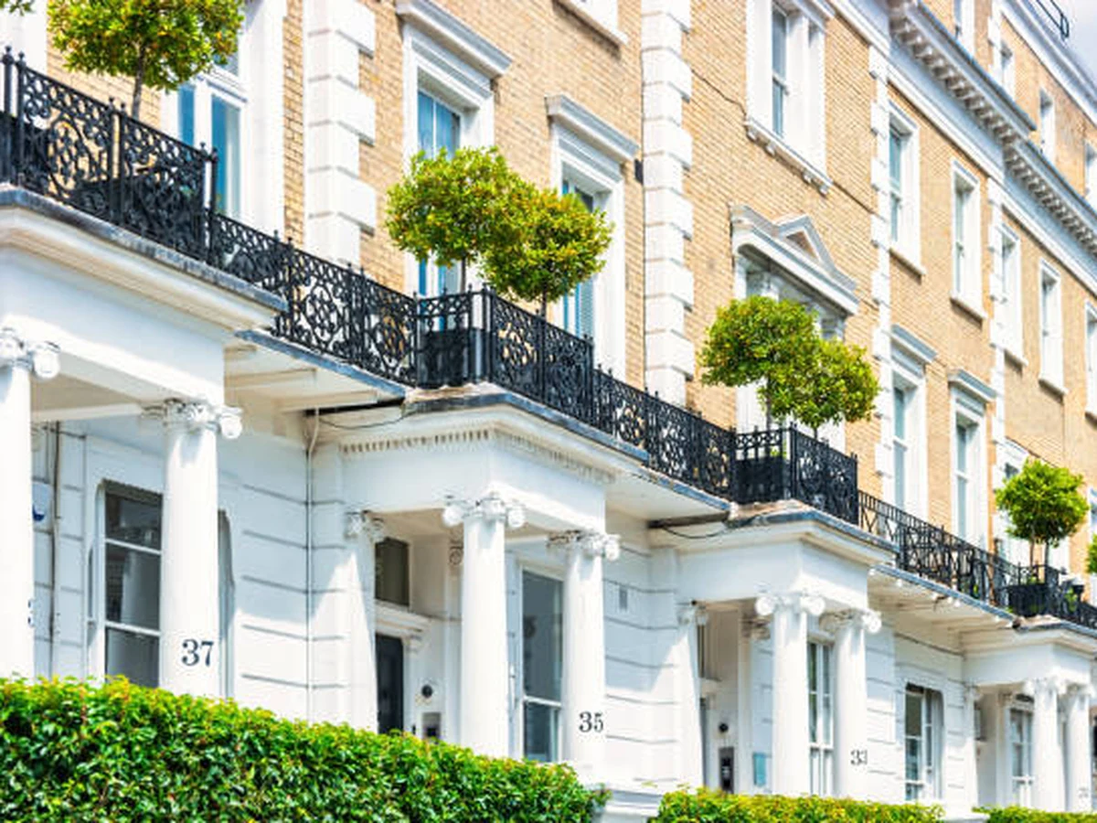 Exterior painting of white stucco Georgian property by Cheshire Painters