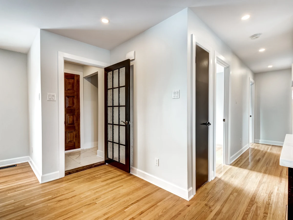 hallway-painting-clean-white-hallway-cheshire-painters Interior door painting in Wilmslow - grey mudroom door finished by Cheshire Painters