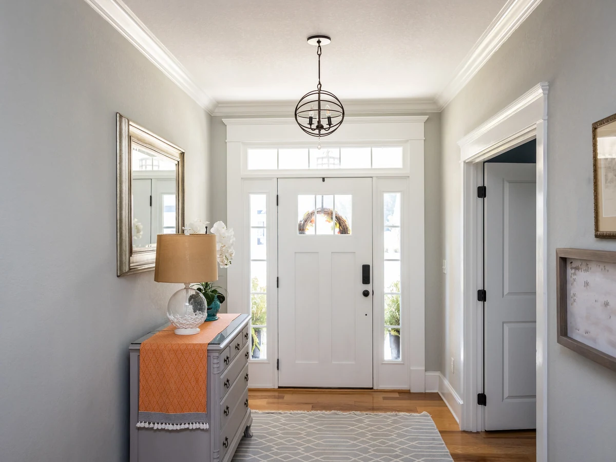 hallway-painting-grey-entrance-hallway-cheshire-painters Grey mudroom with painted door in Wilmslow home