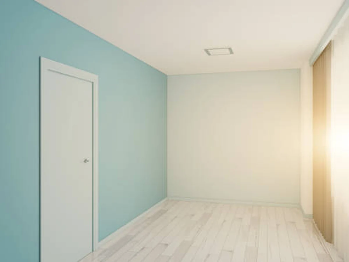 interior-painting-empty-room-pale-cheshire-painters Bright room with green accent wall prepared for wallpapering