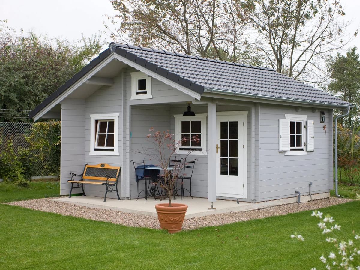 Grey log cabin outbuilding painted by Cheshire Painters in Cheshire